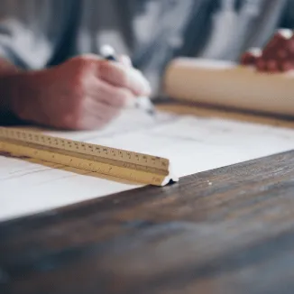 Technical drawing being drafted with a scale ruler